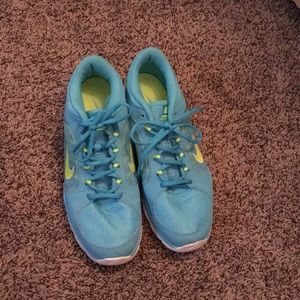 Blue and yellow Nike training shoes